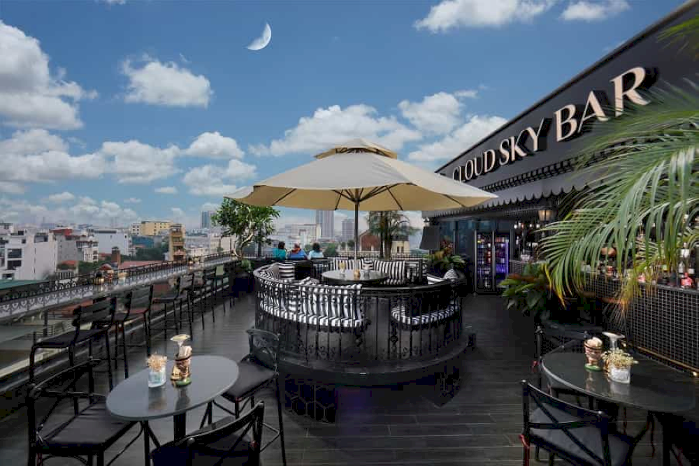 A lively bar with an energetic crowd and great city views